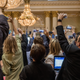 Journalists film Finnish Secret service agents escorting a man from the room before the joint press conference between Donald Trump and Vladimir Putin last week in Helsinki, Finland. The Gaslit Nation podcast lays out what was known about the two leaders’ relationship before the GOP convention.